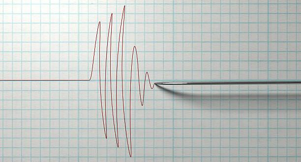Polygraph Needle And Drawing A closeup of a polygraph lie detector test needledrawing a red line on graph paper on an isolated white background polygraph stock pictures, royalty-free photos & images