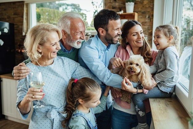 cheerful multi-generation family with a dog having fun while spending time together at home.