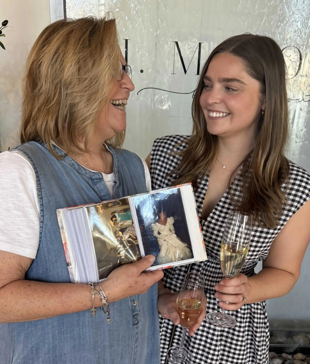 Caitlin shared a truly special moment after saying yes to her gown, celebrating with her mom, who found her own wedding dress at J. Major’s 30 years ago.