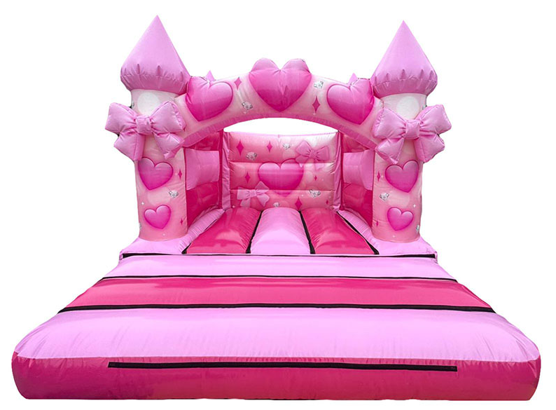 A pink inflatable castle with bows

AI-generated content may be incorrect.