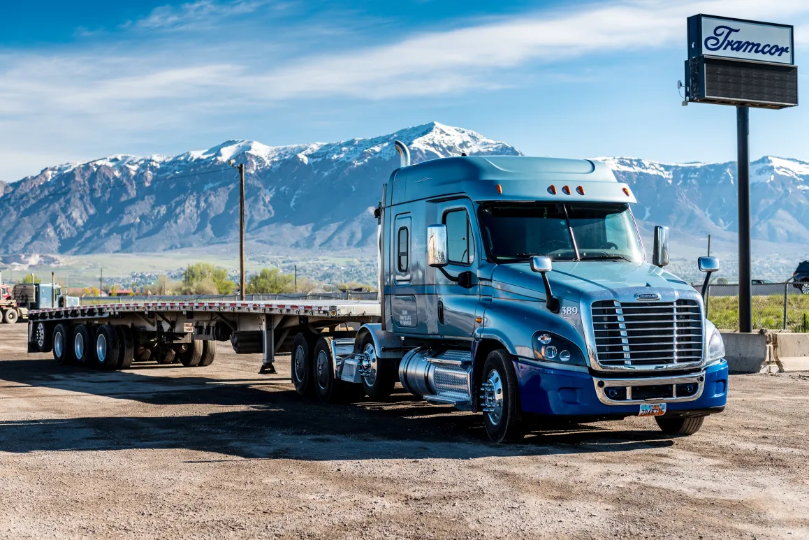 A semi truck parked on a dirt road

AI-generated content may be incorrect.