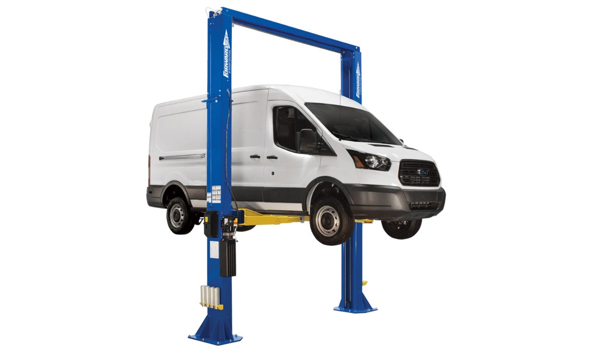 White service van raised on a blue hydraulic garage lift