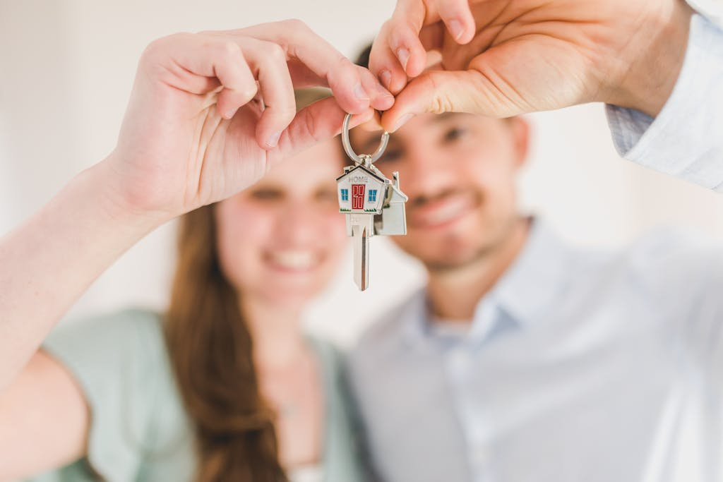 Happy couple holding house keys.