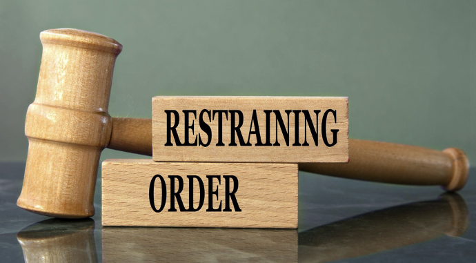 restraining order written on wooden blocks